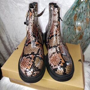 Seven7 Women's Vault snakeskin print boots.